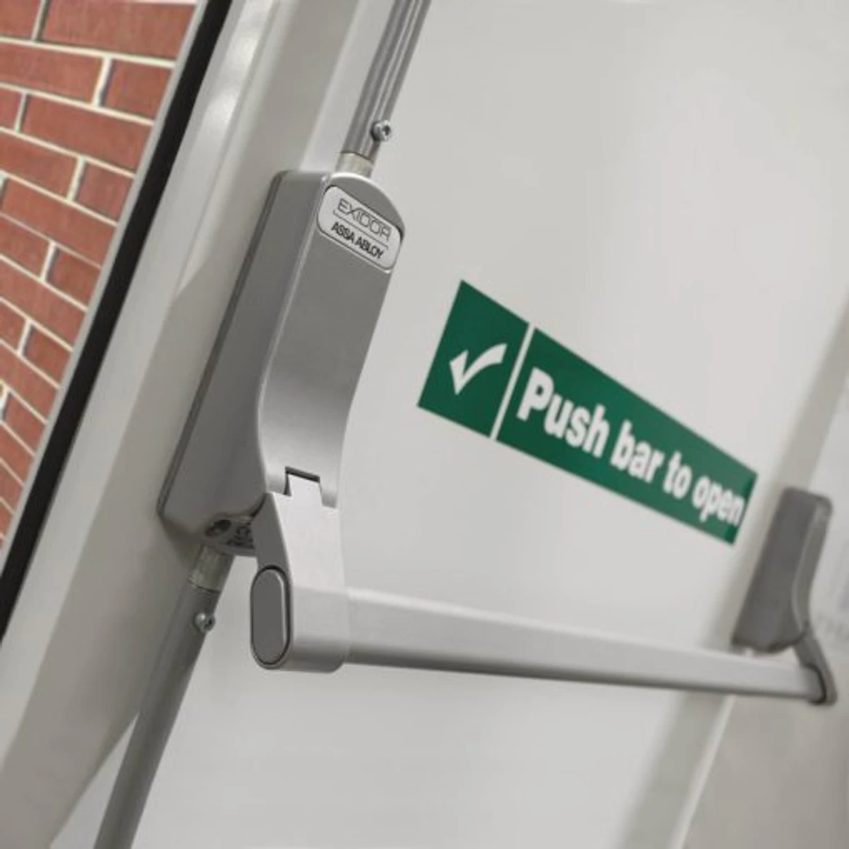 Steel fire exit door with emergency bar installed in 