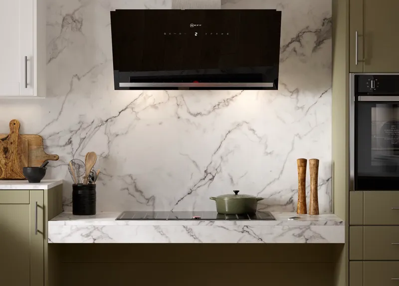 Height-adjustable hob in accessible kitchen for safer cooking access 