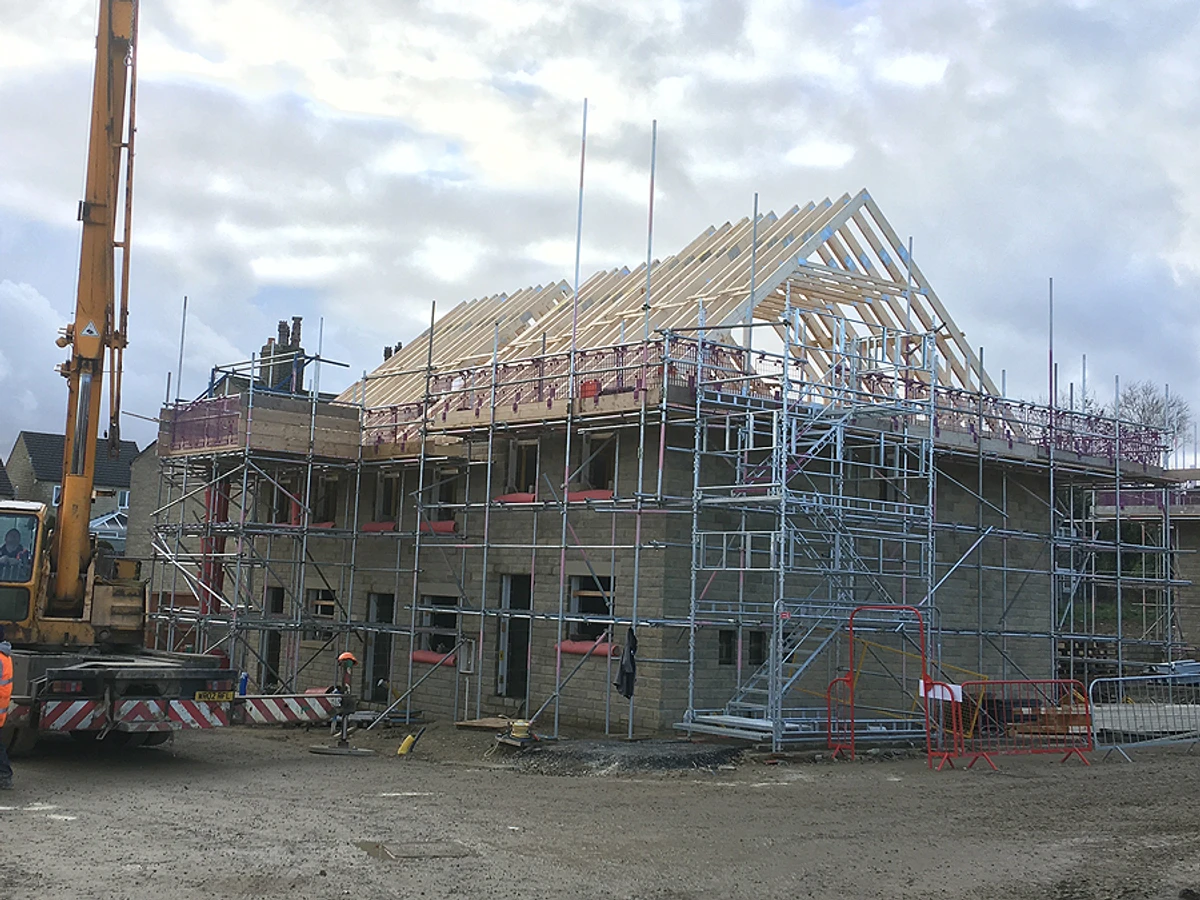 Installation of attic truss roof showing framing and structure 