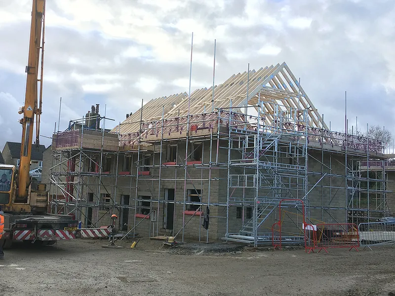 Installation of attic truss roof showing framing and structure 