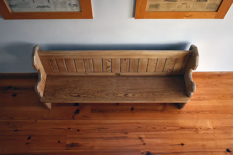 Refinished church pew in restoration project  in Boston Spa
