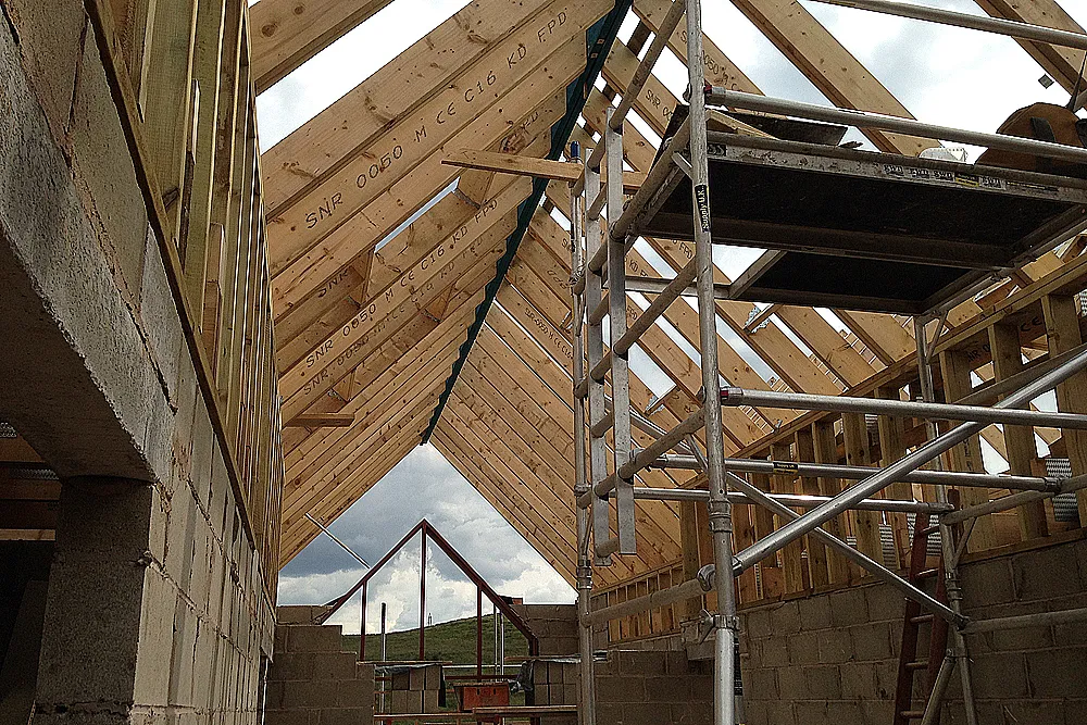 Completed traditional timber roof with intricate cuts and tight joints 