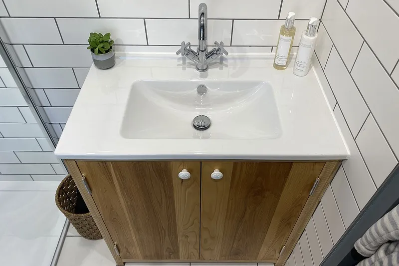 Bespoke ash bathroom vanity cabinet handcrafted with traditional joinery techniques