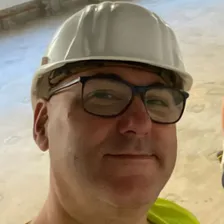 Robert Coulson on site in a hard hat and hi-vis