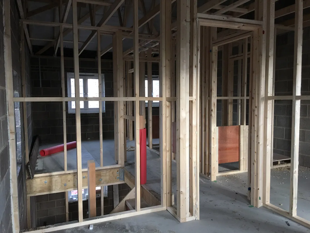 Internal wooden stud wall installation dividing a large space into rooms in Thorp-arch 